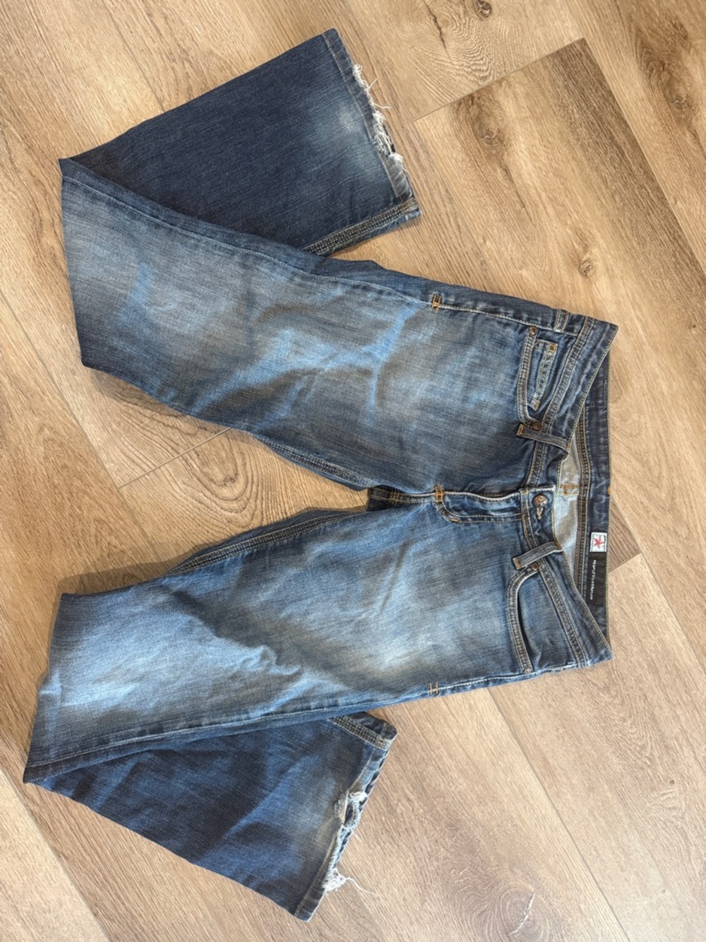 People's Liberation Y2K Faded Blue Bootcut Jeans with Raw Hem